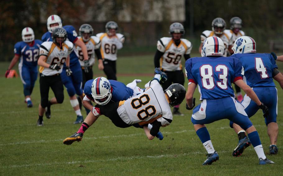 Patch's Sean Loeben is brought down hard in the first quarter of his team's 48-7 semifinal loss Saturday, Oct. 25, 2014, against Ramstein.