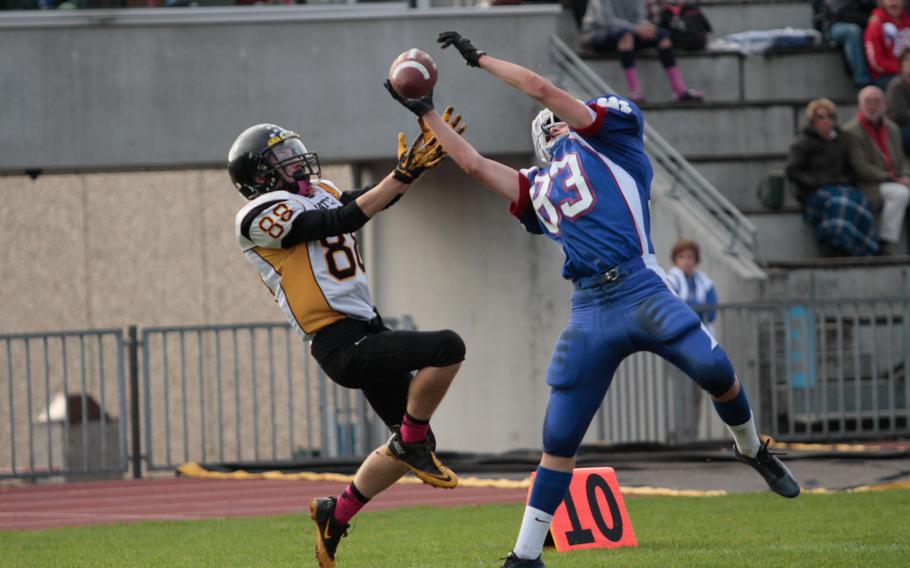 Ramstein's Kyle Glenn nearly reels in a third interception in the Royals' 48-7 win Saturday, Oct. 25, 2014, over Patch for a shot at the DODDS-Europe Division I football title.