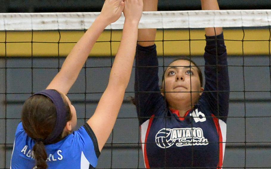Rota'sTalia Pekari, left, and Aviano's Alana Masters battle at the net in opening day Division II action at the DODDS-Europe volleyball finals in Kaiserslautern, Germany, Thursday, Oct. 30, 2014. Aviano beat the Admirals 25-18, 25-16.
