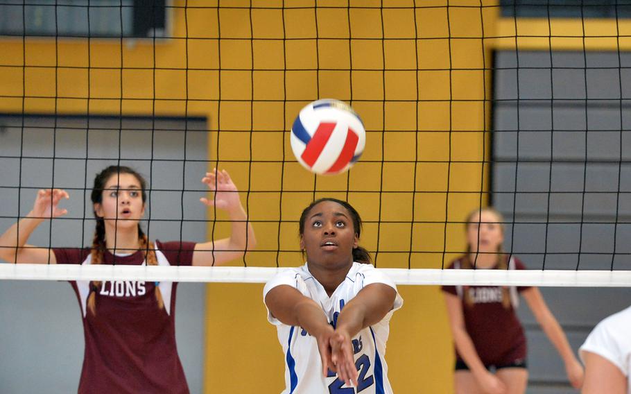 Payton Chandler of Hohenfels bumps the ball in the Tigers' 25-23, 22-25, 15-11 win over AFNORTH in opening day Division II action at the DODDS-Europe volleyball finals in Kaiserslautern, Germany, Thursday, Oct. 30, 2014. Defending at left is Maria Lid.
