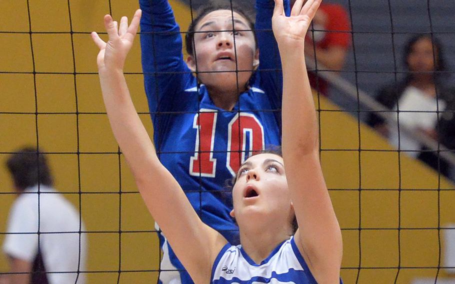Ramstein's Ebony Madrid defends against Wiesbaden's Ashton Cloud in a Division I semifinal at the DODDS-Europe volleyball championships in Ramstein Friday, Oct. 31, 2014. Wiesbaden won 25-22, 25-13,17-25,25-15 to advance to Saturday's final against Naples.