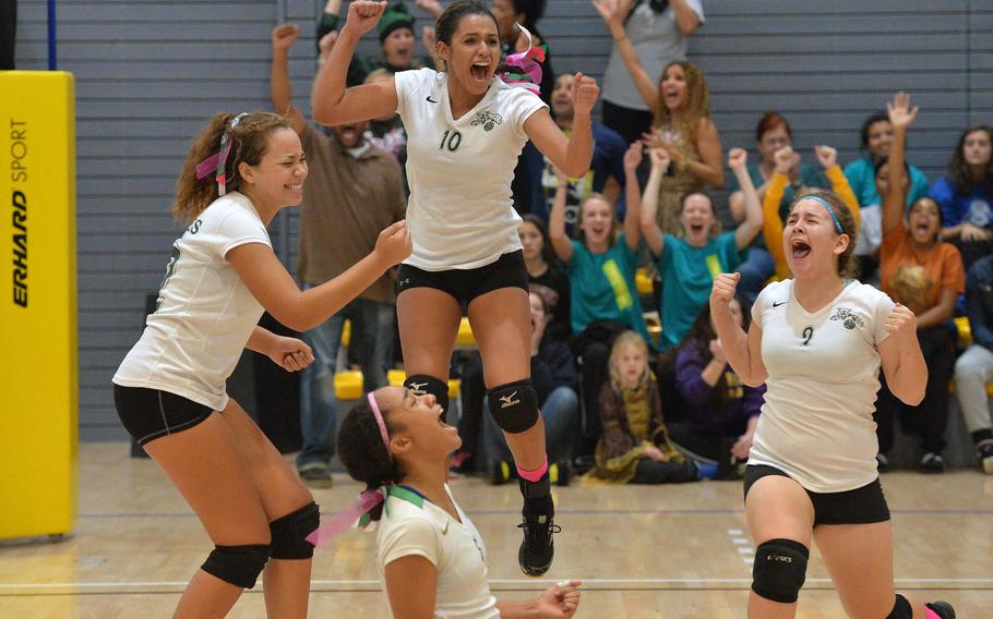 Naples Wildcats Skylar Evans, Leina'ala Esperon, Keylee Soto and Amanda James celebrate their win over Vicenza to advance to the Division I finals of the DODDS-Europe volleyball championships. Down by two sets, Naples won three straight for the 22-25, 20-25, 25-20, 25-11, 15-5 victory and the right to meet Wiesbaden in Saturday's championship.