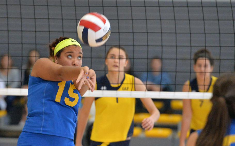 Sigonella's Kisiah Chandler concentrates as she sets the ball for a teammate in the Division III final against Florence at the DODDS-Europe volleyball championships in Ramstein, Germany, Saturday, Nov. 1, 2014. Florence beat Sigonella 25-16, 25-21, 25-21 to take the title.