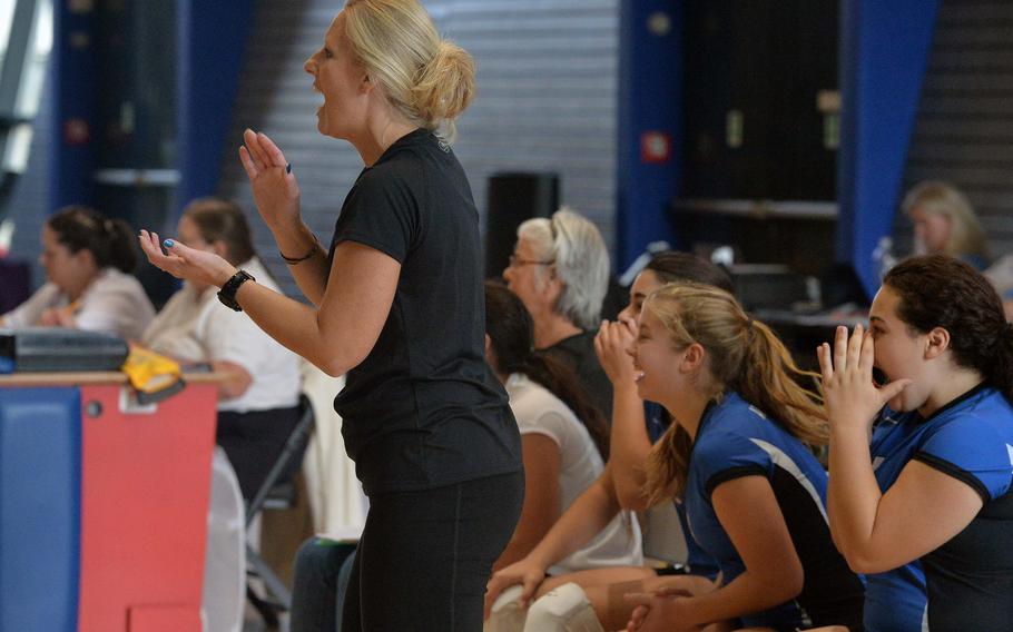 Rota coach Melinda Luna and players celebrate a point in the Division II final at the DODDS-Europe volleyball championships in Ramstein, Germany, Saturday, Nov. 2, 2014. Rota beat Aviano 25-19, 25-18, 25-18.