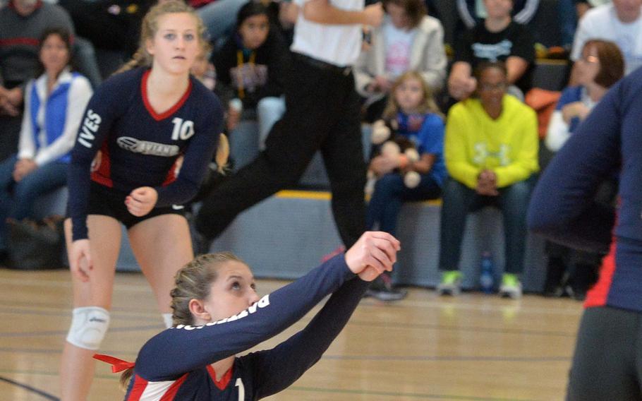 Aviano's Haylea Patterson digs a Rota serve as teammate Rebecca Ives watches in the Division II final at the DODDS-Europe volleyball championships in Ramstein, Germany, Saturday, Nov. 2, 2014. Rota won the match 25-19, 25-18, 25-18.
