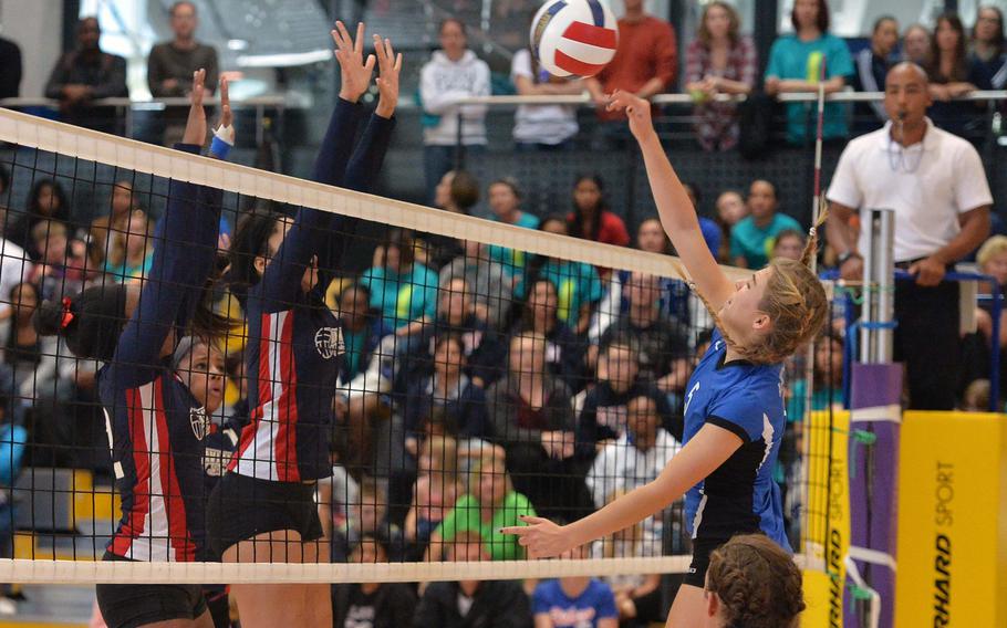 Rota's Tiffani Driscoll knocks the ball past the Aviano block in the Division II final at the DODDS-Europe volleyball championships in Ramstein, Germany, Saturday, Nov. 2, 2014. Rota won the match 25-19, 25-18, 25-18.