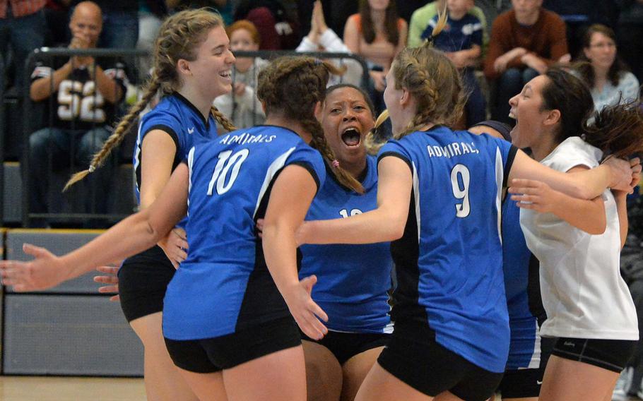 The Rota Admirals players celebrate their Division II championship after beating Aviano 25-19, 25-18, 25-18 at the DODDS-Europe volleyball championships in Ramstein, Germany, Saturday, Nov. 2, 2014.