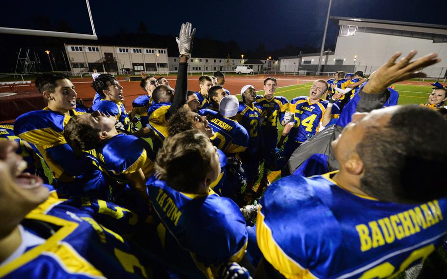 Ansbach players celebrate after defeating Hohenfels to claim the 2014 DODDS-Europe DII football championship in Kaiserslautern, Germany, Nov. 1, 2014.