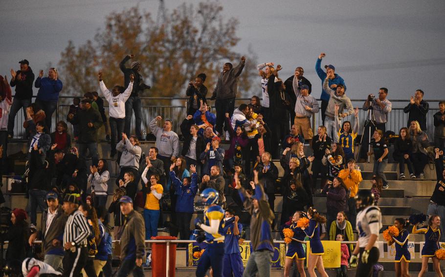 Ansbach fans celebrate after their team scored a touchdown in the 2014 DODDS-Europe DII football championship against Hohenfels in Kaiserslautern, Germany, Nov. 1, 2014.