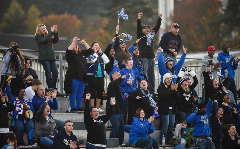 Hohenfels' fans celebrate after their team made a good play in the 2014 DODDS-Europe DII football championship against Ansbach in Kaiserslautern, Germany, Nov. 1, 2014.