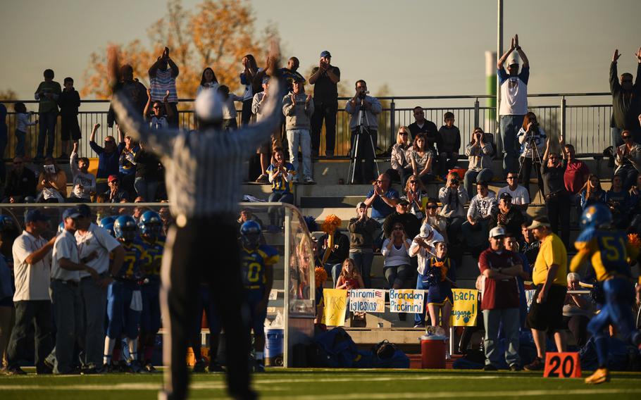 Ansbach fans cheer after their team scored a touchdown against Hohenfels in the 2014 DODDS-Europe DII football championship in Kaiserslautern, Germany, Nov. 1, 2014.