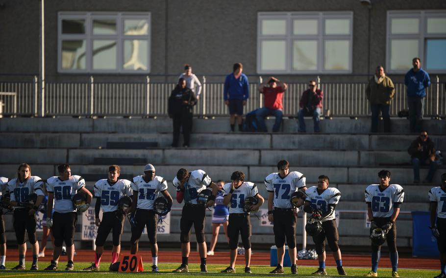 Hohenfels players prepare for national anthem before the start of the 2014 DODDS-Europe DII football championship against Ansbach in Kaiserslautern, Germany, Nov. 1, 2014.