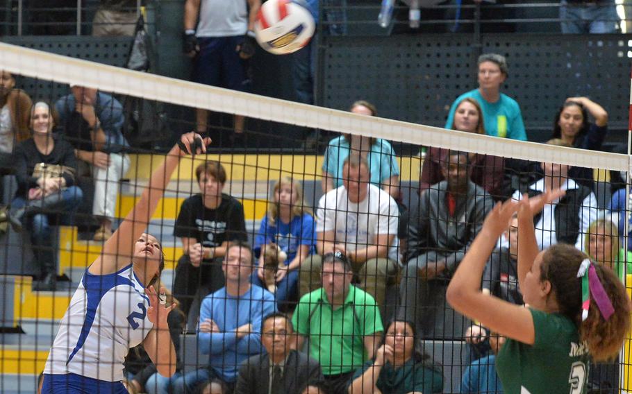 Wiesbaden's Leah Rojas, left, hits the ball over the net against Naples in the Division I final at the DODDS-Europe volleyball championships in Ramstein, Germany, Saturday, Nov. 1, 2014. Rojas has been named the Stars and Stripes volleyball Athlete of the Year.