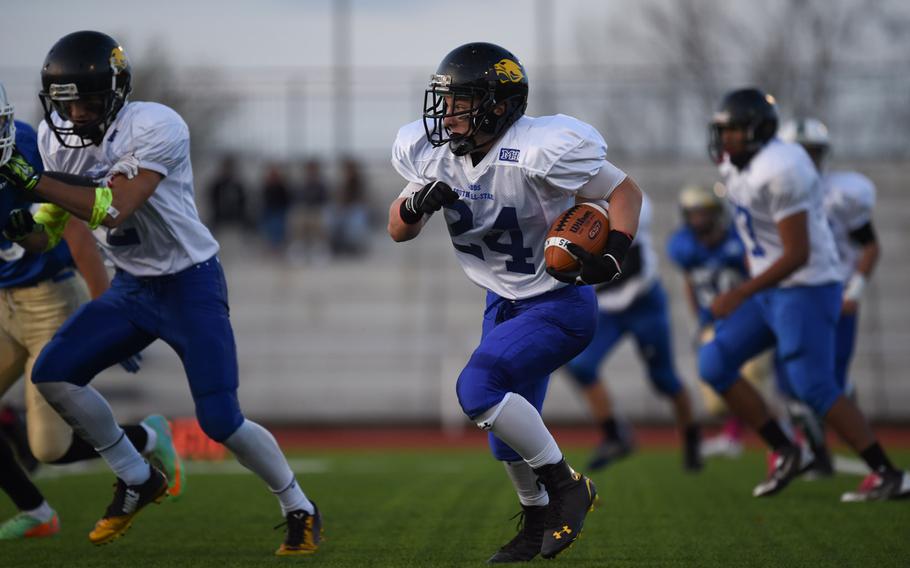 Vicenza's Max Monnard, playing for the South All-Stars, looks for a hole in the DODDS-Europe all-star game Saturday, Nov. 8, 2014.