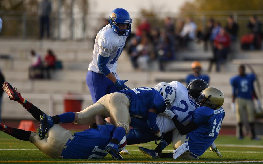 Hohenfels' David Vidovic, playing for the South All-Stars, is taken down at the end of a run Saturday, Nov. 8, 2014, in the South's 20-14 win in the 2014 DODDS-Europe all-star game.
