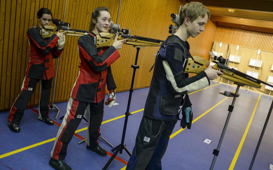 From left to right, Patch's Caelyn Miller, Maggie Ehman and Ben Ferguson prepare to shoot in the bonus round as the top three finishers in the European championships last year.