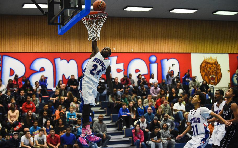 Ramstein's Spencer Wright goes airborne on a fast break against Hohenfels Friday night at Ramstein, Germany.