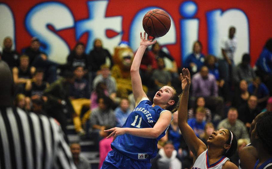 Hohenfels' Shelby Atkinson drives to the hoop Friday night at Ramstein, Germany.
