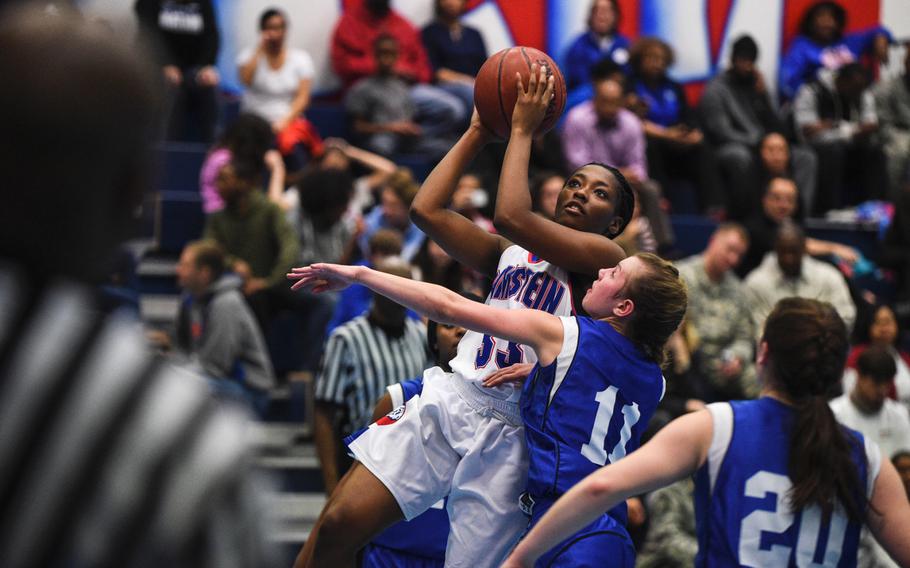 Ramstein's Amethyst Rorie goes up for two against Hohenfels Friday night at Ramstein, Germany.