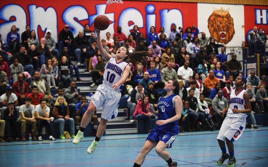 Ramstein's Ebony Madrid lays the ball in for two against Hohenfels Friday night at Ramstein, Germany.