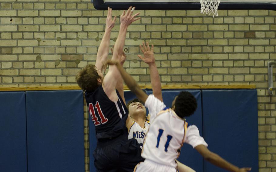 Lakenheath's Koty Bussiere attempts a basket against Wiesbaden during a basketball game on Saturday, Dec. 13, 2014, at RAF Lakenheath, England. Bussiere scored 14 points during the game.