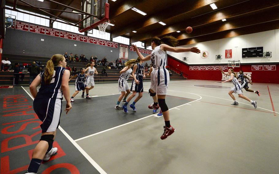 Black Forest Academy forces a turnover while defending a Bitburg inbounds play Alexa during a winter tournament in Kaiserslautern, Germany, Jan. 2, 2015.

