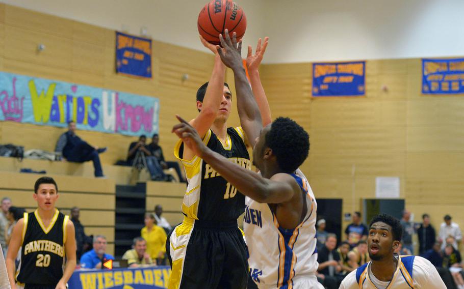 Patch's Pablo Paradis shoots over Wiesbaden's Anthony Little in the Panthers' 53-44 victory over the Warriors in Wiesbaden, Friday, Jan. 16, 2015.