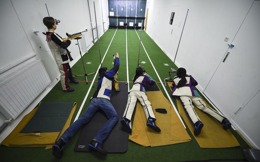 Members of the Kaiserslautern High School marksmanship team, from left to right, Emily Vose, Marco Walter, Valeria Santos and Belle Cyriaque, hone their shooting skills in their school's new four-lane range Tuesday afternoon, Jan. 27, 2015.  

