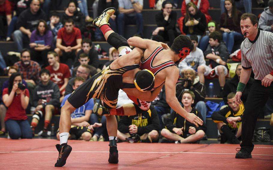 Patch's Elijah Phillips takes down Kaiserslautern's Lawrence Abbott during a sectional wrestling meet at Kaiserslautern, Germany, Saturday, Feb. 7, 2015.

Joshua L. DeMotts/Stars and Stripes