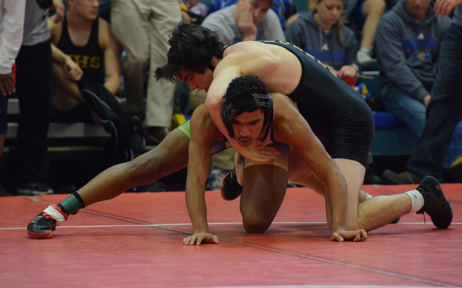 Vicenza's Torin Dennison tries to control Naples' Santos Figueroa on Saturday during a 160-pound match at the Southern sectional qualifiers at Aviano Air Base, Italy. Figueroa pinned Dennison in 2 minutes, 26 seconds.