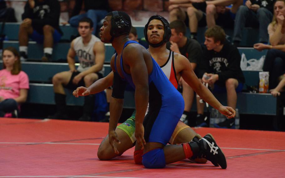 Naples' Santos Figueroa releases his hold from Hohenfels' Malik Jefferson after the referee stopped the clock Saturday during a 160-pound match at Aviano Air Base, Italy. Figueroa beat Jefferson 8-1.