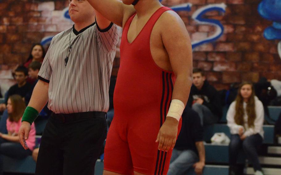 Aviano's Joseph Rivera celebrates after beating Naples' JeLin Mims for first in the 285-pound weight class match at Aviano Air Base, Italy. Rivera pinned Mims in 15 seconds.
