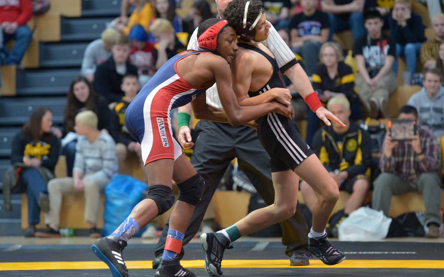 Lakenheath's Brandon Lovett, left, defeated Vilseck's Blaise Markley for the 106-pound title at the DODDS-Europe wrestling championships in Wiesbaden, Germany, Saturday, Feb. 14, 2015.