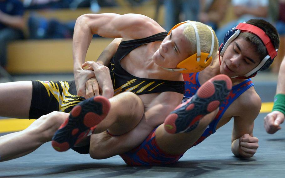 Patch's Christopher Matzke, left, beat Ramstein's Stanley Cruz in the 120-pound final at the DODDS-Europe wrestling championships in Wiesbaden, Germany, Saturday, Feb. 14, 2015.