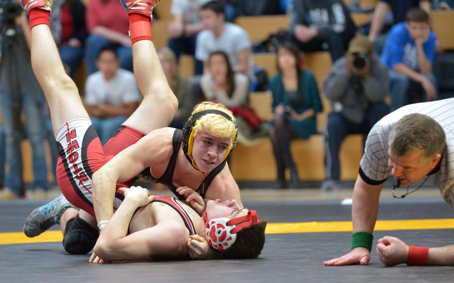 Patch's Matthew Bolduc, top, defeated Kaiserslautern's Evan Heryford to win the 126-pound title at the DODDS-Europe wrestling championships in Wiesbaden, Germany, Saturday, Feb. 14, 2015.