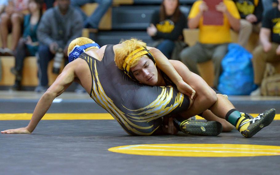 Patch's Johnathan Brabazon, right defeated teammate Isaiah Phillips to take the 132-pound title at the DODDS-Europe wrestling championships in Wiesbaden, Germany, Saturday, Feb. 14, 2015.