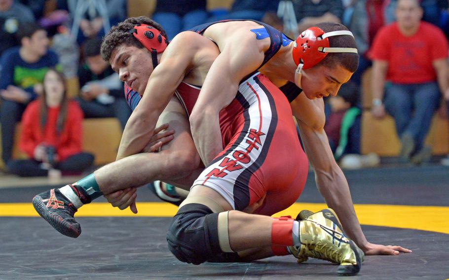 Lakenheath's Emilio Medina, top, defeated Kaiserslautern's Lawrence Abbott to take the 145-pound title at the DODDS-Europe wrestling championships in Wiesbaden, Germany, Saturday, Feb. 14, 2015.