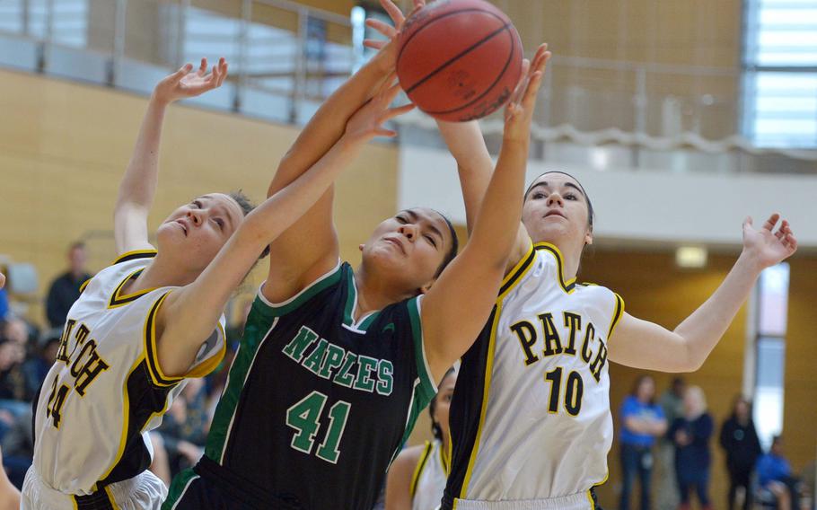 Patch's Abby Zippered, left, and Jaxen Godfrey battle Naples' Aundria Hall for a rebound in a Division I game at the DODDS-Europe basketball championships in Wiesbaden, Germany, Thursday, Feb.19, 2015. Patch won the game 32-20.