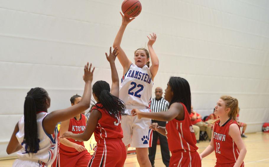 Ramstein's Lindsey Breton sends a pass to teammate Amethyst Rorie in a Division I game against Kaiserslautern at the DODDS-Europe basketball championships in Wiesbaden, Germany, Thursday, Feb.19, 2015. Ramstein beat the Raiders 33-12.