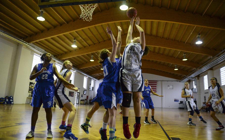 Bitburg's Elise Rasmussen powers up for two against Hohenfels in the second day of DODDS-Europe tournament play, Thursday, Feb. 19, 2015.