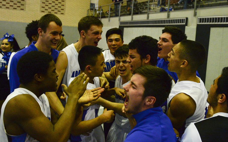 Rota celebrates after defeating AOSR in overtime to clinch a spot in Friday's semi-finals in the second day of DODDS-Europe tournament play, Thursday, Feb. 19, 2015.
