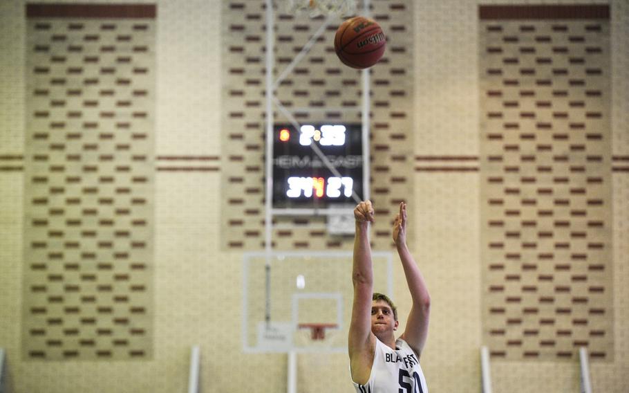 Black Forest Academy's Kaden Proctor shoots a free throw late in their game against AFNORTH in the second day of DODDS-Europe tournament play, Thursday, Feb. 19, 2015.