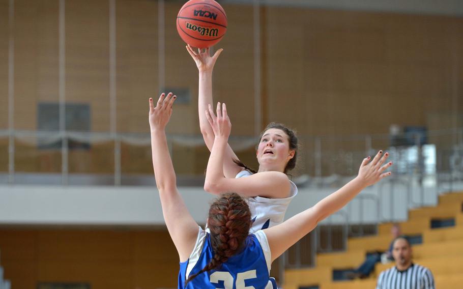Black Forest Academy's Katie Greathouse shoots over Hohenfels' Sierra Standifer in a Division II semifinal at the DODDS-Europe basketball championships in Wiesbaden, Germany, Friday, Feb. 20, 2015. BFA won 26-19 to advance to Saturday's final.