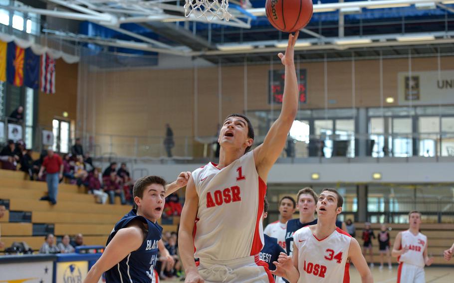 American Overseas School of Rome's Otis Reale goes in for a basket against Black Forest Academy in a Division II semifinal at the DODDS-Europe basketball championships in Wiesbaden, Germany, Friday, Feb. 20, 2015. AOSR beat BFA 63-40 to advance to Saturday's final.