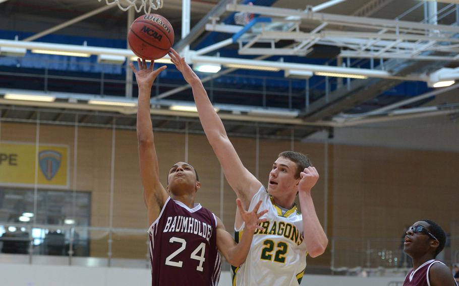 Baumholder's Treyvante Kendrick scores against Alconbury's Joey Behr in a Division III semifinal at the DODDS-Europe basketball championships in Wiesbaden, Germany, Friday, Feb. 20, 2015. Baumholder won 44-29 to advance to Saturday's final.