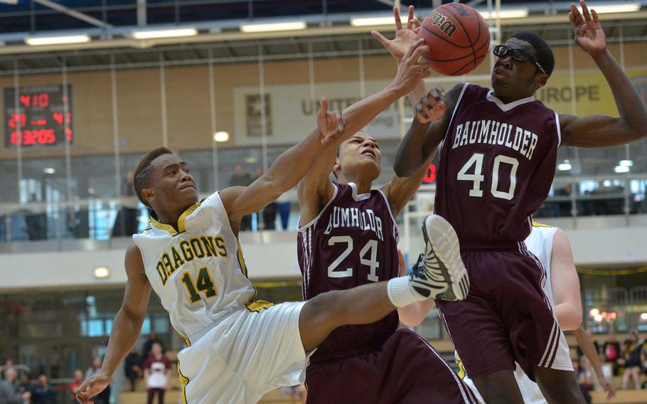 Alconbury's Adarius Gallon and Baumholder's Treyvante Kendrick and Jeff Pierre, from left, fight for a rebound in a Division III semifinal at the DODDS-Europe basketball championships in Wiesbaden, Germany, Friday, Feb. 20, 2015. Baumholder won 44-29 to advance to Saturday's final.