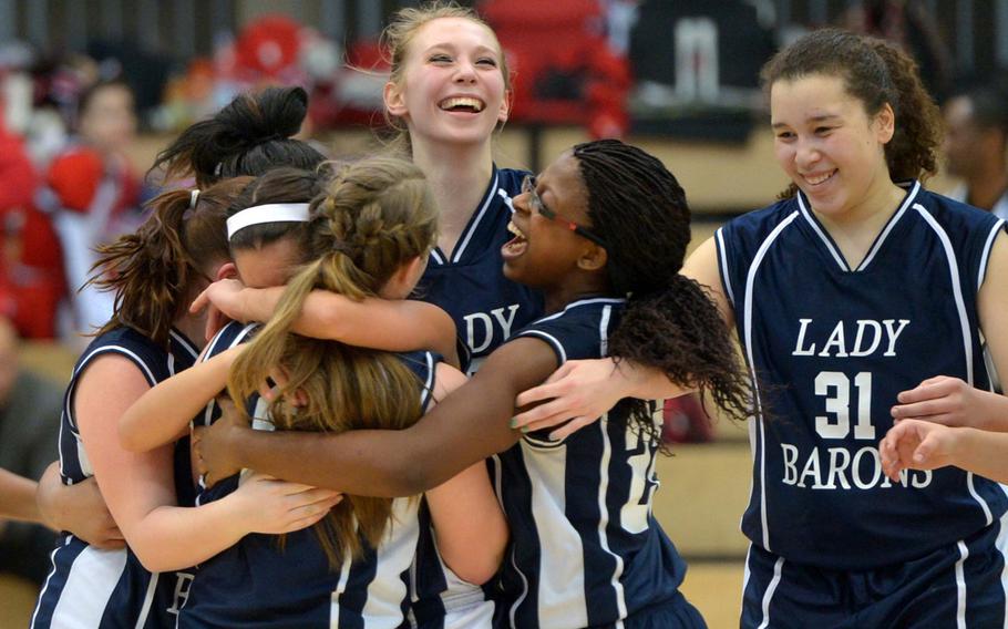 The Bitburg Barons celebrate their 34-27 victory over Black Forest Academy in the girls Division II championship game in Wiesbaden, Germany, Saturday Feb. 21, 2015. 