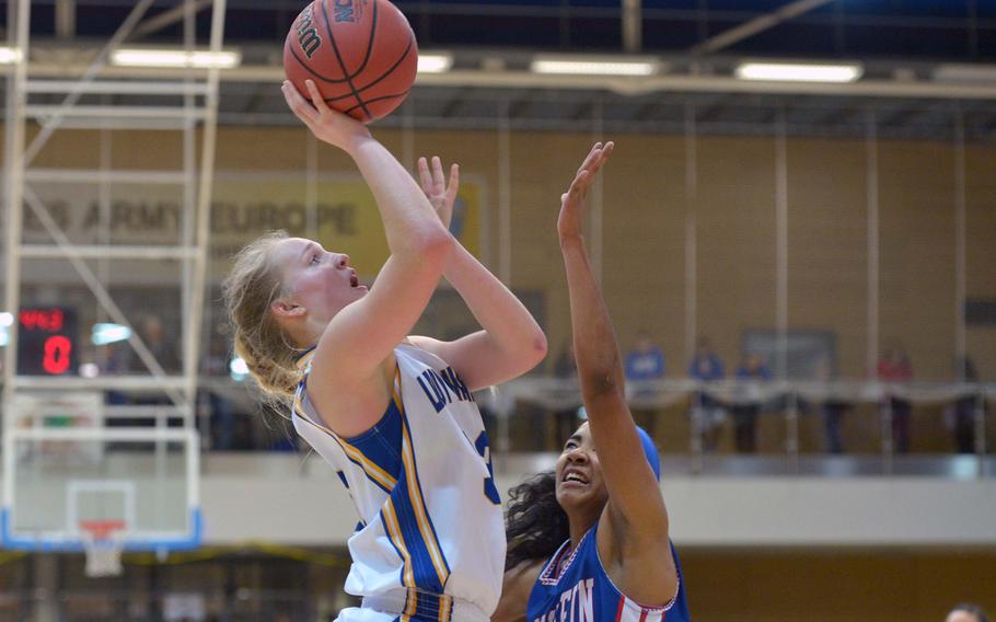 Wiesbaden's Catherine Klein shoots over Ramstein's Rezana Todman in the girls Division I championship game at the DODDS-Europe basketball championships in Wiesbaden, Germany, Saturday Feb. 21, 2015. Wiesbaden beat Ramstein 32-26 to defend their title.