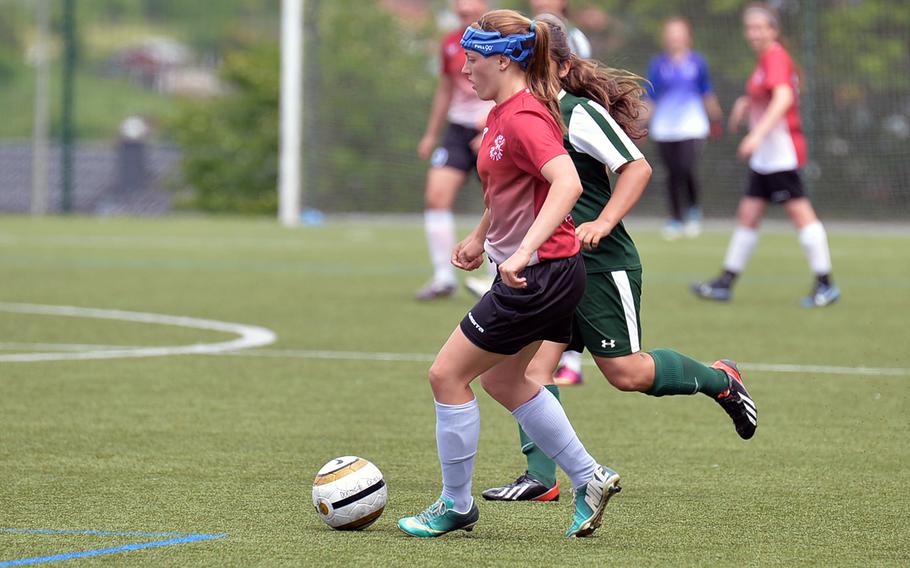 AFNORTH's Caitlyn Helwig takes the ball up the field against Alconbury at the DODDS-Europe soccer championships in Reichenbach, Germany, Wednesday, May 21, 2014. Helwig will be returning for the Lions when the 2015 season kicks off.