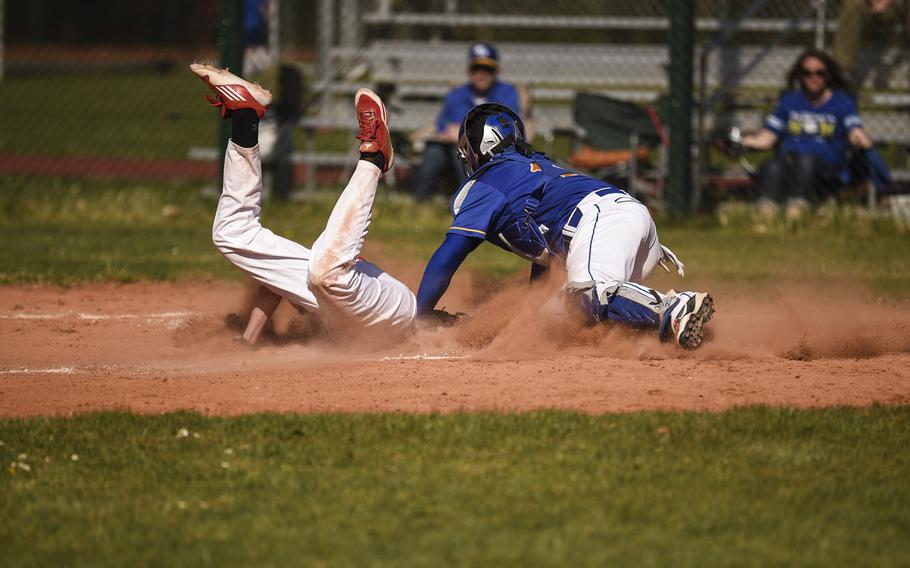 Wiesbaden's Zach Natal tags Kaiserslautern's Devin Towlson out at home plate Wednesday at Kaiserslautern, Germany.